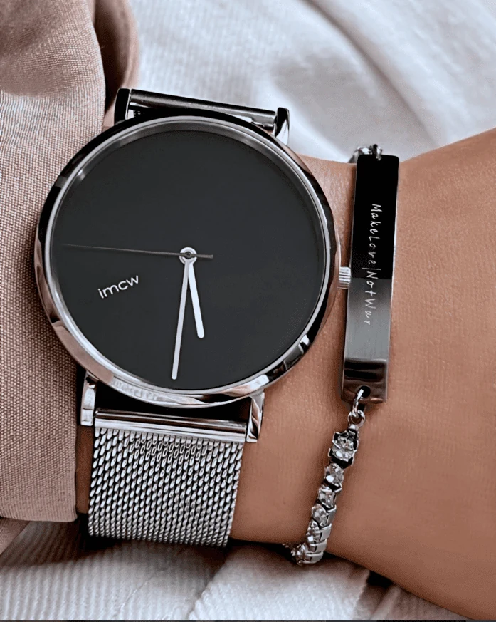 IMCW black dial watch and bracelet worn together